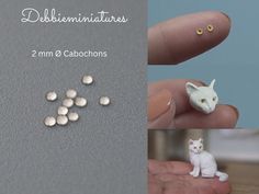 tiny white cat figurines sitting on top of a table