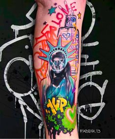 the statue of liberty is on top of this colorful leg sleeve tattoo by fabrik13