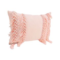 a pink and white pillow with fringes on it