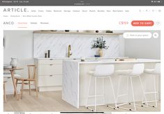 an image of a white kitchen with marble counter tops and bar stools in it