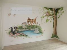 this is an image of a room with deer and tree mural on the wall,