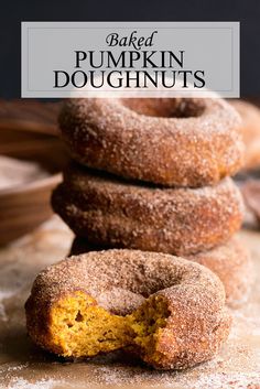 baked pumpkin doughnuts stacked on top of each other