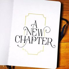 an open notebook with the words a new charter written in cursive writing on it