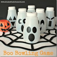 there are halloween decorations on the table with boo's bowling game written on it