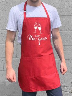 For the classy party host toasting in the new year. Premium quality 7oz twill apron with adjustable neck. Four front utility pockets 100% cotton apron Measures 30" long by 24" wide Machine wash cold with like colors. Tumble dry low. Professionally printed. Makes a great gift. Bbq King, Funny Aprons, Grill Apron, Bbq Kitchen, Bbq Apron, Christmas Aprons, Aprons For Men, Printed Aprons, Utility Pockets