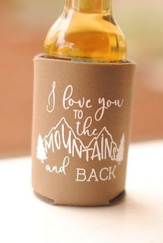 a bottle with a label on it that says i love you to the mountains and back