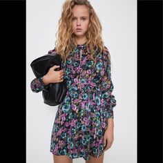 Floral Dress With Metallic Thread Purple Floral Dress For Party, Purple Floral Print Mini Dress For Spring, Spring Purple Floral Print Mini Dress, Chic Purple Floral Dress, Spring Purple Floral Mini Dress, Purple Mini Dresses For Fall, Purple Mini Dress For Fall, Purple Mini Dress For Dress Down Occasions, Purple Mini Dress For Casual Wear