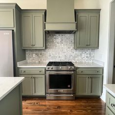 a stove top oven sitting inside of a kitchen