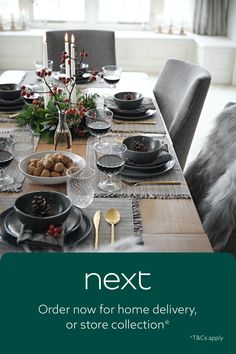 a dining room table set for christmas dinner