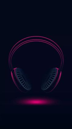 the neon headphones are glowing in pink and blue lights on a dark background, which is