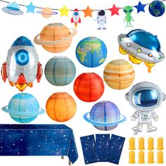 an assortment of space themed party decorations