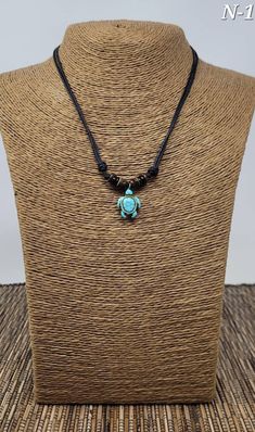 "Turquoise Turtle Necklace Adjustable Unisex Necklace Handmade Necklace with Turquoise Turtle Bead, Black Wooden Beads and Black Cord Adjustable Cord - Fits Most Size Styles N-1, N-2, N-3, N-4 and N-5 are adjustable with sliding knots from 16\" Inches up to 30\" Inches Around the neck. The N-5 -Set. The bracelet adjust from from 6\" inches up to 10\" inches around the wrist Each picture describes the style that you will receive If you choose it at checkout. FAST SHIPPING! Visit my Etsy Shop to s Adjustable Beaded Turquoise Necklace For Meditation, Handmade Turquoise Necklace For Meditation, Spiritual Adjustable Turquoise Necklace Gift, Turquoise Pendant Beaded Necklace For Meditation, Turquoise Nickel-free Necklace For Beach, Adjustable Turquoise Necklaces For Healing, Adjustable Turquoise Amulet Necklace, Adjustable Turquoise Healing Necklace, Adjustable Spiritual Turquoise Necklace For Beach