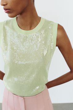 SLEEVELESS SEQUIN KNIT TOP Chic Green Tank Vest, Stretch Crew Neck Tank Top For Party, Spring Sleeveless Sequin Vest, Sleeveless Sequin Tank Top For Summer, Sleeveless Sequin Blouse For Spring, Spring Sequined Sleeveless Blouse, Spring Sequin Sleeveless Vest, Sequin Sleeveless Tank Top For Summer, Sequin Sleeveless Blouse For Spring