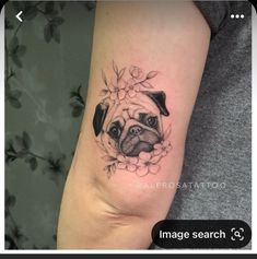 a small pug tattoo on the left inner arm and leg, with flowers around it