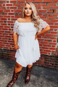 Off-the-shoulder dolman style dress with a scalloped lace overlay and flowy ruffle trim skirt. With its lightweight and airy fabric, it's made for golden hour good times. Part of our Southern Fried Chics collection, Curvy Chic approved.