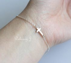 Silver cross bracelet, Sideways cross bracelet, Baptism gift, Mothers day gift, Keep Faith Strong, Cross jewelry, Everyday bracelet     This listing is for photo 1 & 2, Sideways cross bracelet.  This entire bracelet is made of sterling silver material. Cross charm is 11mm x 6mm. Bracelet is 7 inches from end to end. (default length)  Bracelet can be made from 5 - 8 inches. Leave your desired length at Checkout.  BRACELET WITH INITIALS: https://www.etsy.com/listing/127507707  GOLD CROSS BRACELET: https://www.etsy.com/listing/127585177  ALL CROSS JEWELRY: https://www.etsy.com/shop/DelicacyJ/search?search_query=CROSS  UPGRADE SHIPPING: https://www.etsy.com/shop/DelicacyJ?section_id=7646141SHIPPING: - My current shipping time is 1-5 business days. - Delivery for US is 3-5 business days after s Silver Cross Bracelet, Jewelry Everyday, Everyday Bracelet, Note Box, Baptism Gifts, Cross Bracelet, Cross Jewelry, Gift Message, Gold Cross