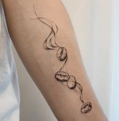 a woman's arm with a tattoo on it that is shaped like a snake