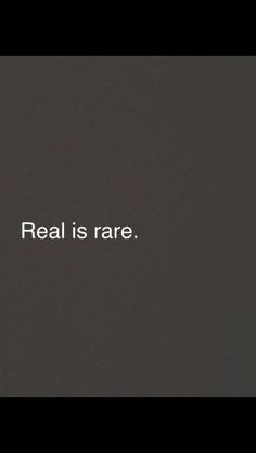 the words real is rare written in white on a black background