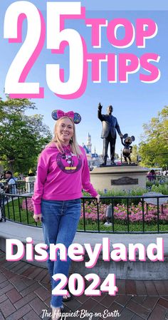 a woman standing in front of a statue with the words 25 top tips disneyland on it