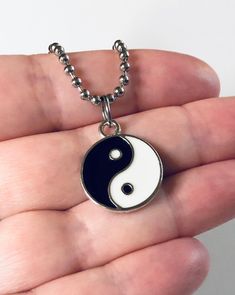 "Yin & Yang necklace, Yin and Yang necklace, unisex black and white with silver charm, on a ball chain necklace which is STAINLESS STEEL. Boho chic bohemian. Occult esoteric jewelry 💕 Yin & Yang is a concept of dualism with its roots in Taoism/ philosophy. The Yin or dark side is associated with shadows, femininity & the trough of a wave, the Yang or light side represents brightness, passion & growth, both sides present duality, both sides work together. *this is a super cute ne Symbolic Black Jewelry With Adjustable Chain, Symbolic Black Necklace With Adjustable Chain, Black Symbolic Jewelry With Adjustable Chain, Symbolic Black Stainless Steel Necklace, Black Metal Clavicle Chain Charm Necklace, Trendy Black Nickel-free Necklace, Black Spiritual Nickel-free Necklace, Nickel-free Black Spiritual Necklaces, Black Nickel-free Spiritual Necklaces