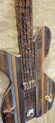 a guitar made out of wooden planks and strings