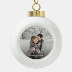 a white ornament with an image of a couple on it