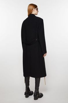 Acne Studios black double-breasted coat is crafted from a wool blend with a chest welt pocket and two front flap pockets. Cut to an exaggerated fit with shoulder pads and a mid-calf length. FN-WN-OUTW000847 Black Long Wool Coat With Concealed Fastening, Black Wool Long Coat With Concealed Front, Black Wool Coat For Workwear, Black Wool Coat For Work, Black Double-breasted Wool Coat, Modern Black Wool Coat With Double Button Closure, Black Double-breasted Wool Coat With Concealed Placket, Black Double-breasted Structured Outerwear, Black Structured Double-breasted Outerwear