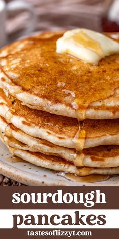 a stack of pancakes with butter and syrup on top