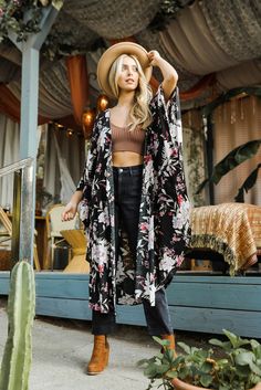 Get effortless bohemian style with our Floral Butterfly Sleeve Kimono. This lightweight, long kimono features a stunning floral print, perfect for adding a touch of elegance to any outfit. The open front design and butterfly sleeves create a flowing, casual chic silhouette. Ideal for summer festivals, beach outings, or casual layering, this versatile kimono offers comfort and style. Available in beautiful black and teal blue, it's the perfect addition to your boho chic wardrobe. Immediate Shipping Wholesale Packs of 6 One Size Fits Most Size: 0-18 Black Floral Kimono, Kimono Outfit, Beach Kimono, Kimono Wrap, Summer Cardigan, Butterfly Sleeve, Floral Butterfly, Boho Kimono, Long Kimono