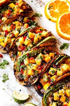 grilled pineapple and avocado salsa on toasted bread with orange wedges