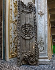 an old door in the corner of a room