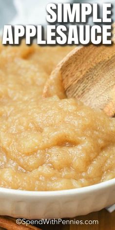 a white bowl filled with applesauce on top of a wooden table