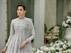 Embellished Grey Gown Lehenga Pakistani Wedding Dresses is an embellished dress that gives you a marvelous, elegant appearance in this dress. Fast Shipping Silver Party Dress For Eid, Floor-length Gown With Pearl Embroidery For Eid, Floor-length Pearl Embroidered Gown For Eid, Silver Dress For Wedding And Eid, Silver Wedding Dress For Eid, Silver Embroidered Dress For Eid, Elegant Silver Gown For Eid, Silver Wedding Gown For Eid, Silver Gown With Resham Embroidery For Eid