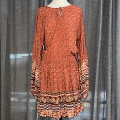 Questions? Leave A Comment Below! Brand New Wild Moss Brand Dress. Rust Copper Colors, Cute With Boots Or Sandals. Bought For Myself But It's Too Short For My Personal Taste. I'm 5'11. Size Is Xl Flowy Casual Boho Dress, Casual Boho Dress In Rayon For Fall, Flowy Orange Boho Dress With Long Sleeves, Casual Brown Boho Print Dress, Casual Orange Long Sleeve Boho Dress, Orange Flowy Long Sleeve Boho Dress, Flowy Long Sleeve Orange Boho Dress, Casual Long Sleeve Mini Dress With Boho Print, Casual Brown Rayon Dress