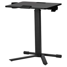 a black computer desk sitting on top of a metal stand