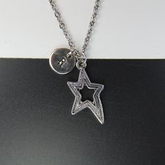 ♥ Star Necklace Star charm Necklace Valentine Gift Star Gift Personalized Necklace Initial Necklace ♥ This is a beautiful star charm with hand stamped initial charm on a stainless steel chain, You able to choose initial from a drop down menu, ♥ You will receive 1 necklace ♥ Star charm 26x15 mm ♥ Initial charm 10 mm choose from a drop down menu ♥ Stainless steel chain 18 inches If you need help with your first purchase on Etsy, here is a helpful guide : http://www.etsy.com/help/article/339 ♥ addi Star Charm Initial Pendant Necklace As Gift, Silver Star-shaped Personalized Necklace, Personalized Sterling Silver Star Charm Necklace, Personalized Silver Star Necklace, Initial Pendant Jewelry With Star Charm As A Gift, Initial Pendant Jewelry With Star Charm, Personalized Silver Star Charm Necklace, Starfish Charm Metal Necklace For Gift, Metal Necklace With Starfish Charm For Gift