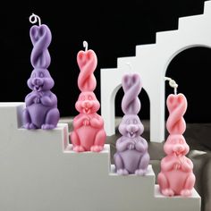 three small candles in the shape of bunnies