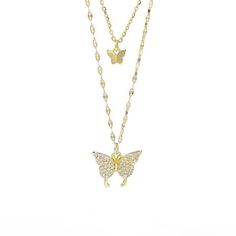 Introducing our Fluttering Elegance: Gold Butterfly Two Layer Necklace: a stunning piece adorned with butterfly pendants encrusted in cubic zirconia. This necklace exudes elegance and charm, perfect for any occasion. Elevate your style effortlessly with its versatile design and captivating sparkle. 18k Gold Plated Brass Smaller Link Chain Measures 14 Inches with 2 Inch Extension Longer Link Chain Measures 16 Inches Lobster Clasp Butterfly Pendant .5 Inches Imported 100% Happiness Guarantee Retur Fine Jewelry Cubic Zirconia Necklace With Butterfly Charm, Luxury Butterfly Necklace With Diamond Accents, White Gold Butterfly Necklace With Cubic Zirconia, Formal Cubic Zirconia Butterfly Charm Jewelry, Elegant Diamond Butterfly Charm Necklace, Luxury Diamond Butterfly Necklaces, Elegant Diamond Butterfly Necklace With Charm, Elegant Butterfly Necklace With Cubic Zirconia, Luxury Diamond Butterfly Pendant Necklace