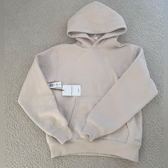 With Tags Xsmall Beige Hooded Athleisure Hoodie, Cozy Warm Sweatshirt For Streetwear, Beige Cozy Fleece Hoodie, Cozy Beige Fleece Hoodie, Cream Hoodie With Kangaroo Pocket For Winter, Cream Cozy Hoodie With Double-lined Hood, Cozy Cream Hoodie With Double-lined Hood, Warm Fleece Hoodie For Streetwear, Beige Winter Hoodie With Kangaroo Pocket