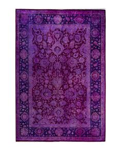 a purple rug with an intricate design on it