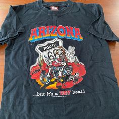 "Title: Arizona T-shirt Size: Small Made in: USA Material: Cotton Pit to pit: 18\" Length: 25\"" Vintage Tour Shirt, Y2k Skull Print Streetwear T-shirt, Y2k Skull Print Cotton T-shirt, Y2k Skull Print Crew Neck T-shirt, Casual Screen Print T-shirt For Biker Events, Graphic Tee For Biker Events With Crew Neck, Cotton Biker T-shirt With Graphic Print, Biker Cotton T-shirt With Graphic Print, Cotton Biker Top For Biker Events