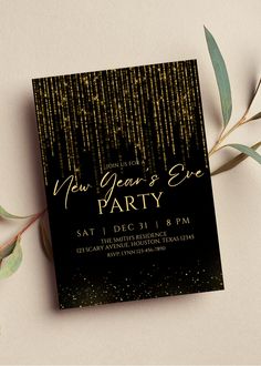 a black and gold new year's eve party with greenery on the side