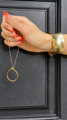 Gold-plated over brass. Adjustable. Gold Jewelry With Adjustable Small Hoop Chain, Gold Small Hoop Jewelry With Adjustable Chain, Adjustable Gold Plated Modern Cuff Bracelet, Luxury Brass Cuff Bracelet, Adjustable Gold Open Circle Jewelry, Gold Brass Open Circle Jewelry, Gold Tarnish-resistant Stainless Steel Cuff Bracelet, Adjustable Modern Gold-plated Cuff Bracelet, Luxury Statement Gold-plated Cuff Bracelet