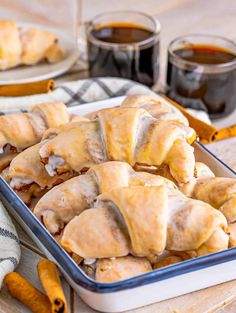 cinnamon crescent rolls in a baking pan on a wooden table with the title overlay