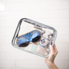 a person holding a tray with some items in it