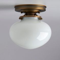 a white light hanging from a ceiling fixture