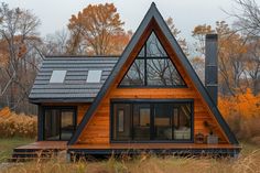 a small wooden house with a pitched roof