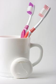 Two toothbrushes in a cup and dental floss. Common toiletries , #Affiliate, #dental, #cup, #toothbrushes, #toiletries, #Common #ad Dental Floss, Brushing, Abstract Design, Brushing Teeth, Design Ideas, Stock Images, Design, Art