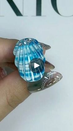 24K views · 2.7K reactions | "Dive into elegance with these enchanting sea shell nails! 🐚💙 Let your nails be the jewels of the ocean. 

#MermaidVibes #ShellNailArt #OceanicElegance #MermaidManicure #SeashellChic #NailArtInspiration #SeasideGlam #UnderTheSeaNails #ShellDesigns #NailGoals #MermaidNails #BeachyManicure #NailDesignIdeas #BlueBeauty #nailaddict #naillover #nailstudent

User | deepthirani gujaran|NAIL ARTIST| | Selena Gomez · Love On Sea Shell Nails, Shell Nails, Mermaid Nails, Sea Shell, Blue Nails, Under The Sea