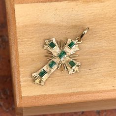 Estate/ Vintage 18KT yellow gold ornate detail cross pendant with genuine, green emeralds Length: 27mm not including bail; 32mm including bail  Width: 19mm Bail measures: 5mm x 6mm  Weight: 1.56 grams Approx. 1.65 total carat weight of emeralds  Flat Back (6) square genuine, green emeralds Stamped 18K Chain shown in pictures is sold separately.  Makes a fantastic gift for the holidays, birthday gift, or a gift of self-appreciation! Check out all our estate crosses + entire jewelry collection! Please let us know if you have any questions. Thank you, Legacy Saint Jewelry FOLLOW US ON INSTAGRAM: @legacysaintjewelry WEBSITE: legacysaintjewelry.com  -OUR RETURN POLICY-  To return an item you must first contact us within 7 days of receiving your item(s). Upon messaging us we will provide the ste Green Spiritual Cross Pendant Jewelry, Ornate Cross, Saint Jewelry, Pearl Accessories, Rose Gold Pendant, White Gold Necklaces, White Gold Earrings, Rose Gold Bracelet, Yellow Gold Bracelet